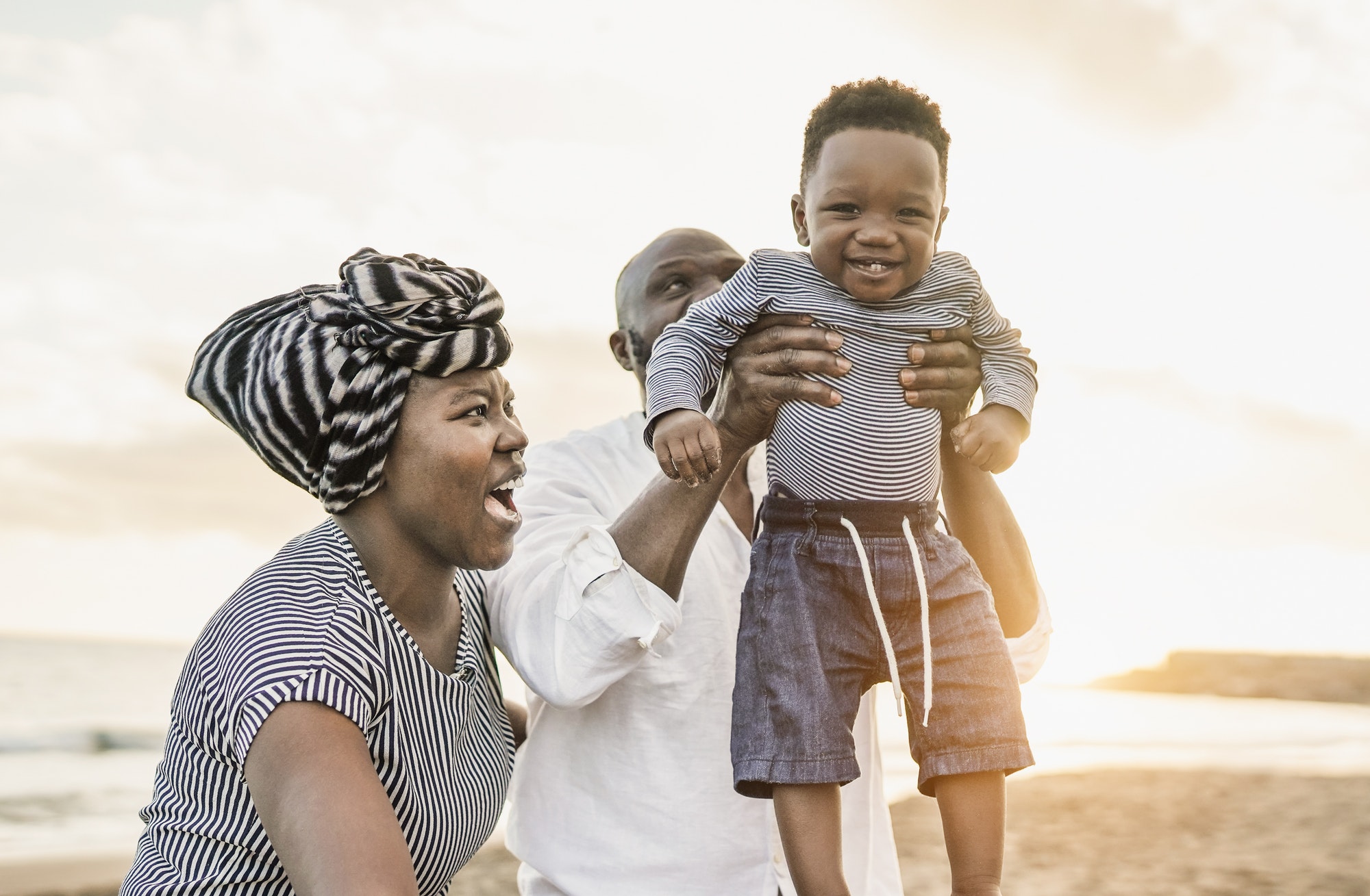 Cute african toddler smiling in camera - Black family enjoy summer vacation